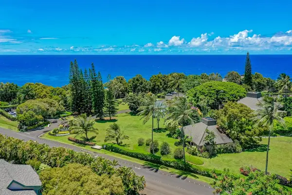 Aerial Overview of Coastal Property Grounds leading to Deep Blue Ocean Views