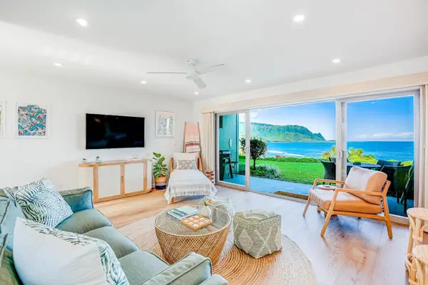 Bright Living Room with Plush Seating, Flat-Screen TV & Panoramic Ocean Views