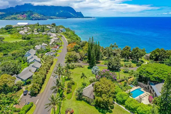 Spectacular High Aerial View of Coastal Resort Community, Pool Complex & Mountain Backdrop