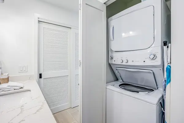 Convenient In-Unit Laundry Nook featuring Stacked Washer and Dryer