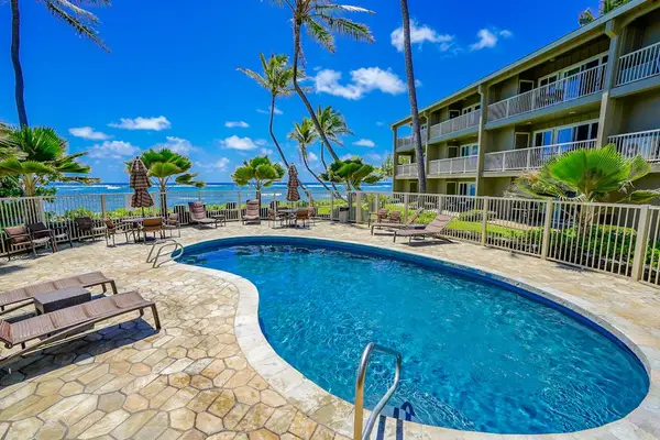 Relax poolside surrounded by tropical landscaping