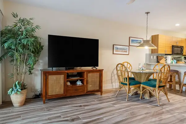 Open lounge area welcomes conversations beneath breezy ceiling fans daily