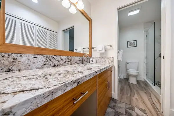 Spacious bathroom combines practical storage with polished modern finishes daily