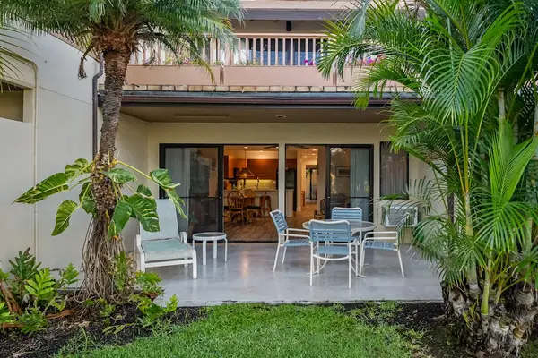 Outdoor patio opens toward palms greenery and gentle island breezes