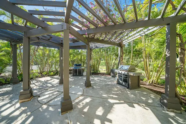 Outdoor barbecue area welcomes relaxed island cookouts beneath swaying palms