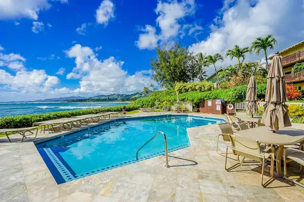 Lounge comfortably beside the beautiful community pool