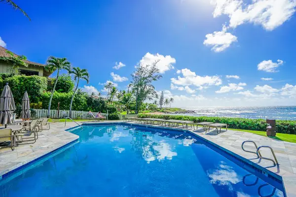 Lounge by the pool with cool island breezes