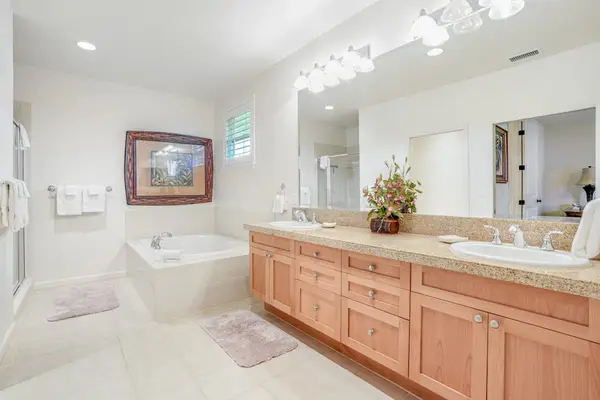 Master bathroom with double sinks, garden tub and a walk in shower.