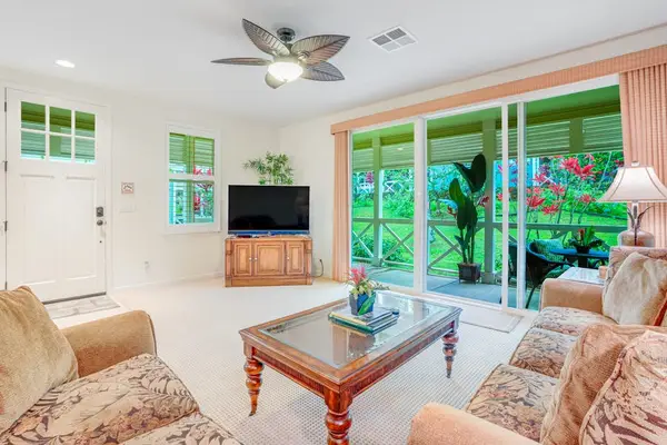 Living room with plenty of comfortable seating, flat screen tv and access to your private lanai.