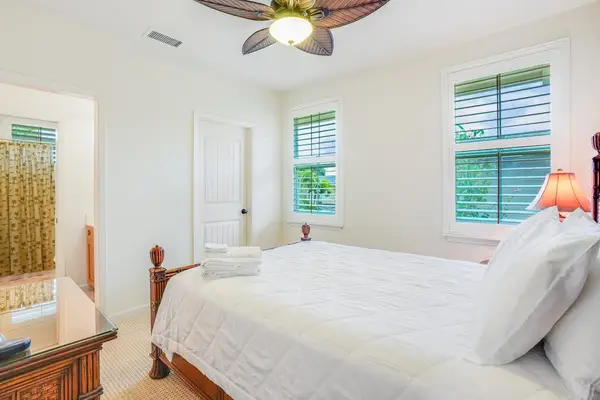 Guest bedroom with queen bed and en-suite bathroom.