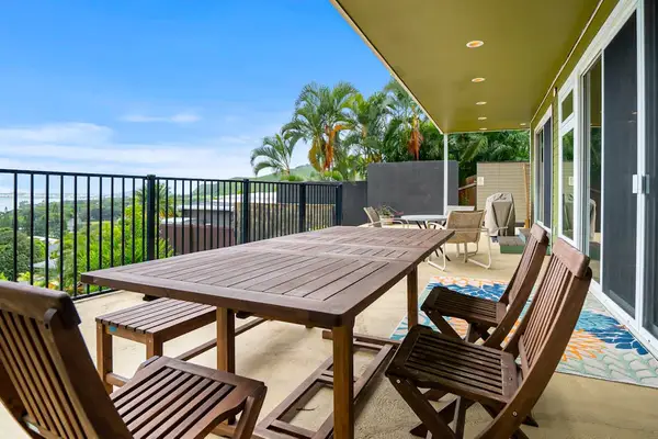 Bright living space opens toward tropical scenery