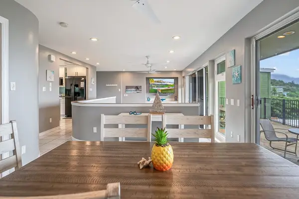 Bright, open-concept living with floor-to-ceiling doors that seamlessly blend indoor comfort with stunning tropical ocean views