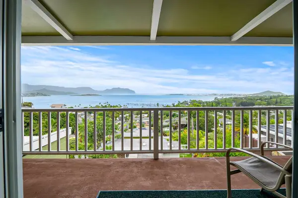 Patio seating with expansive island and ocean views