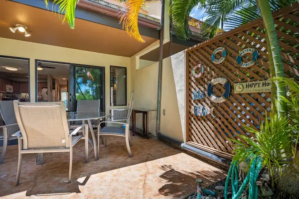 Covered patio offers outdoor chairs garden views and gathering space