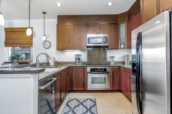 Fully Equipped Modern Kitchen with Stainless Steel Appliances