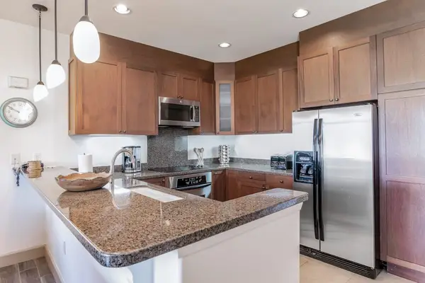 Gourmet Kitchen featuring Granite Countertops and Ample Cabinetry