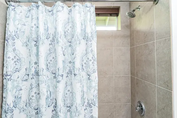 Tiled Shower/Tub Combination with Coastal Accents