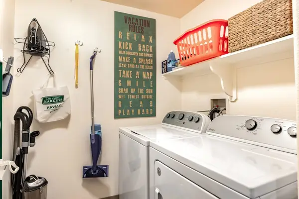 Laundry Room with In-Unit Washer, Dryer, and Utility Supplies