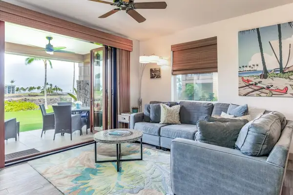 Bright Living Room with Comfortable Sectional and Lanai Access