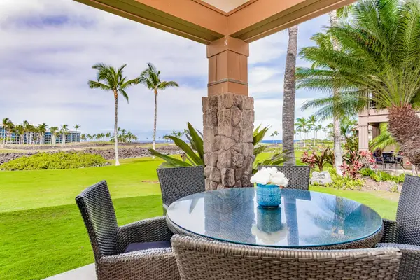 Covered Patio Dining Area with Scenic Lawn and Ocean Views