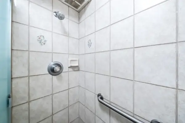 Clean And Spacious Shower Area Stocked For Guests