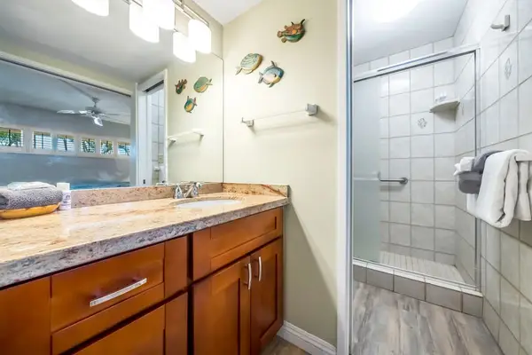 Bright En-Suite Bathroom Featuring Custom Tile Shower