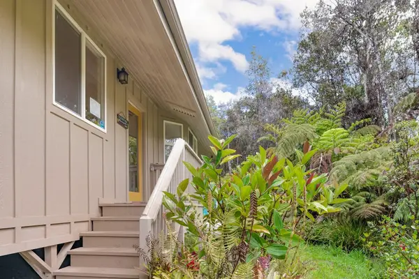 Welcoming Entry Surrounded by Lush Flora