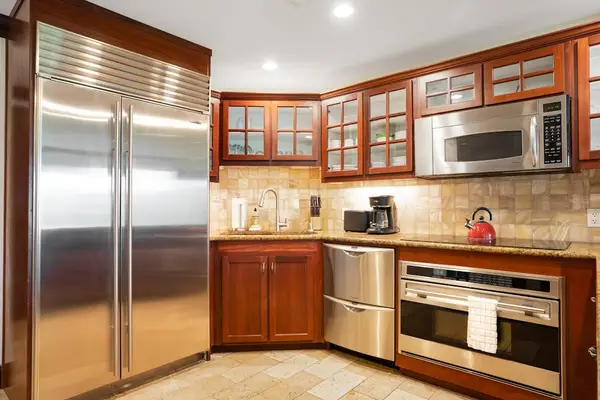 Prepare and enjoy delicious meals in the modern kitchen featuring sleek stainless steel appliances.