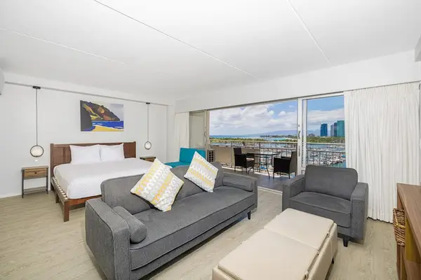 A cozy living room with a bright sliding door to let the sunshine in