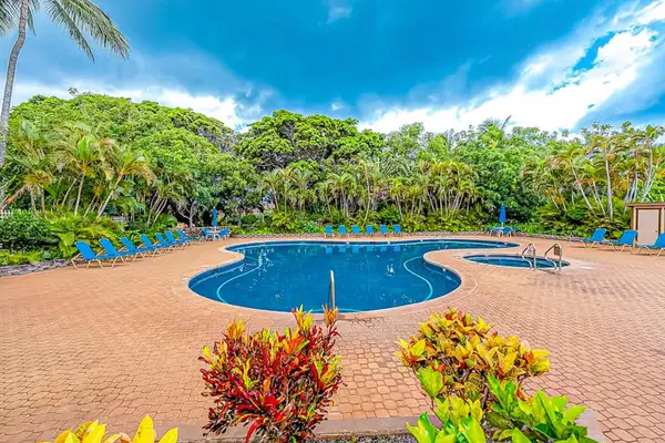 Refresh in the inviting resort pool surrounded by beautiful tropical island scenery throughout