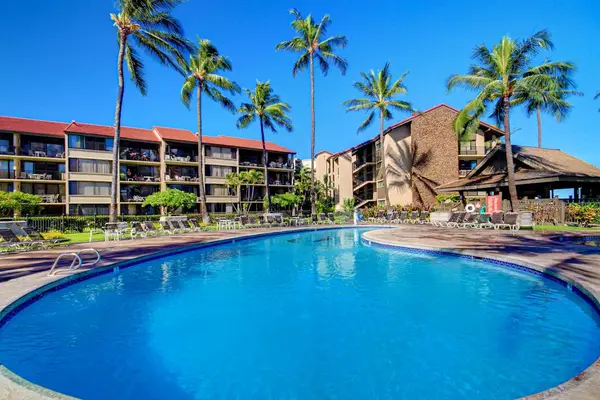 Take a refreshing swim in the resort-style pool surrounded by swaying palms.