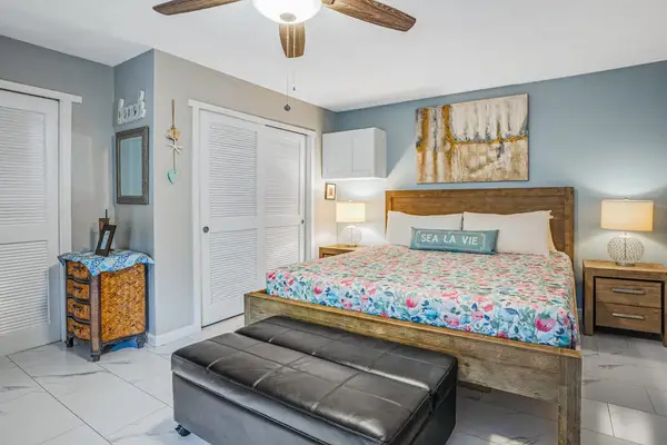 Bright Primary Bedroom With Coastal Charm