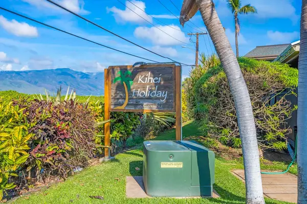 Tropical Resort Entrance Surrounded By Lush Greenery