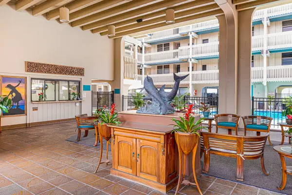 Covered lobby lounge with local artwork and a relaxed island vibe.