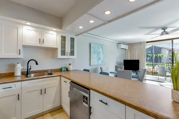 Cook with ease in the fully equipped kitchen featuring modern appliances.