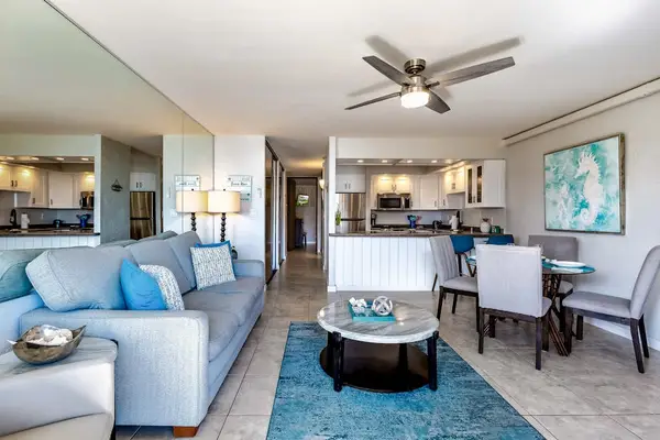 Relax in the bright open-concept living room designed for comfort.