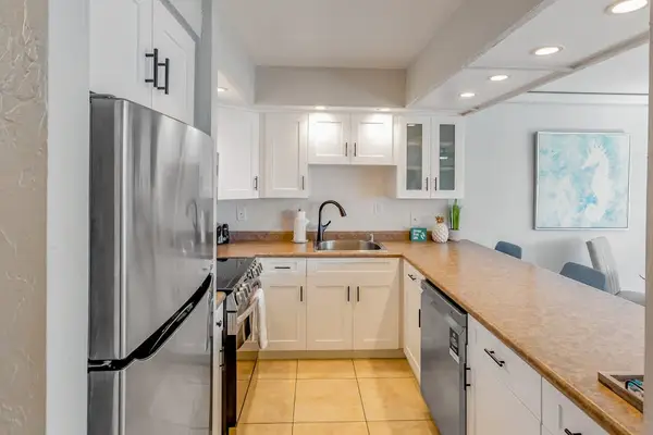 The spacious kitchen provides ample counter space for preparing your favorite meals.