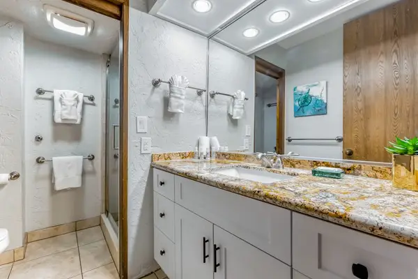 The spacious full bathroom features a double vanity for added convenience.