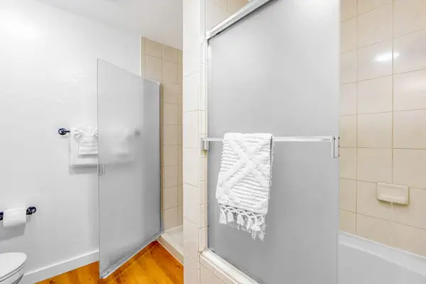 Bright Full Bathroom With Walk In Shower
