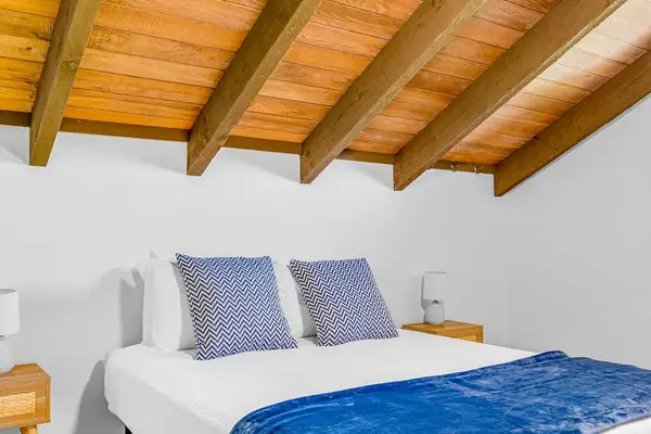 Charming Loft Bedroom With Vaulted Ceilings