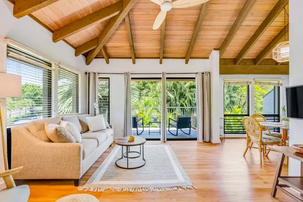 Sun Filled Living Room With Forest Views