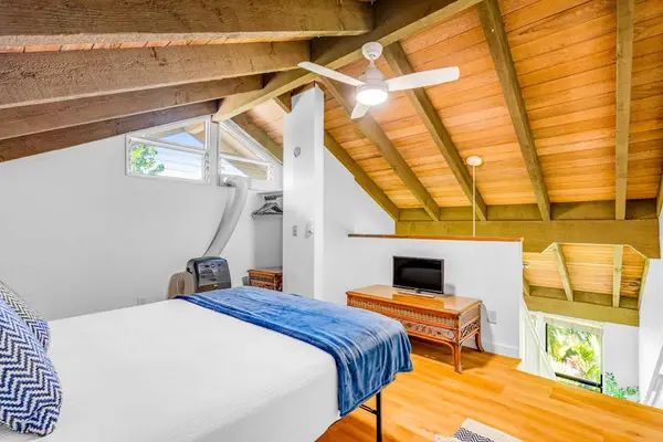 Cozy Loft Bedroom With Vaulted Ceilings