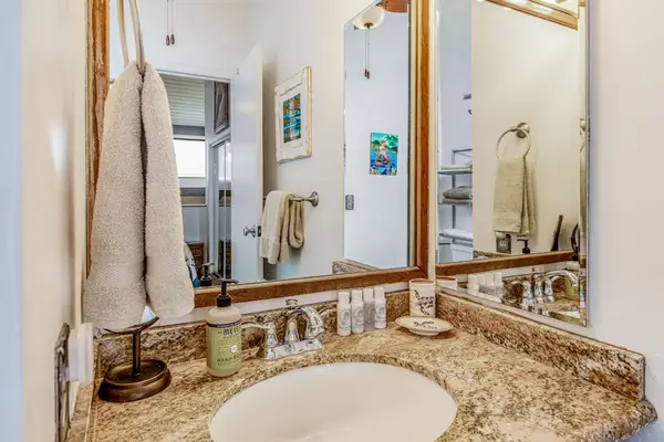 Resort Style Bathroom With Granite Vanity