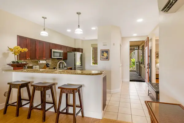 Three barstools at the kitchen counter for help from your sous chef or extra company.