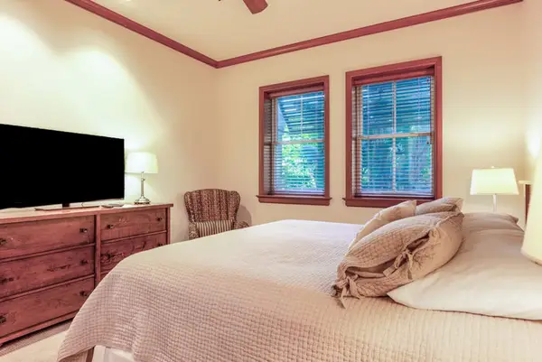 Comfortable bedroom with TV and natural light