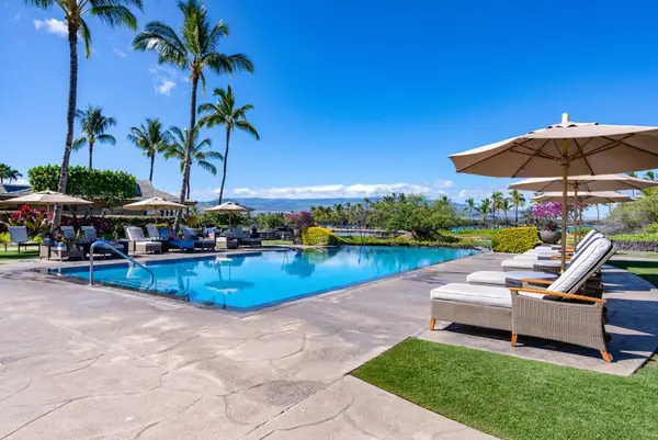 Relax by the resort-style pool under tropical skies