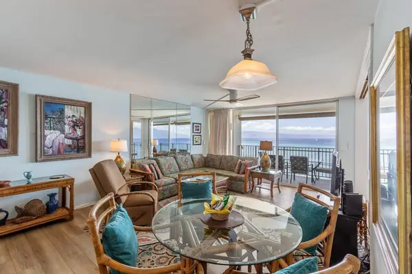 Dining room with table for four.  With this open concept feel you still have views of the turquoise waters.