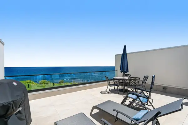 Terrace with loungers, perfect for relaxing to the sound of the waves