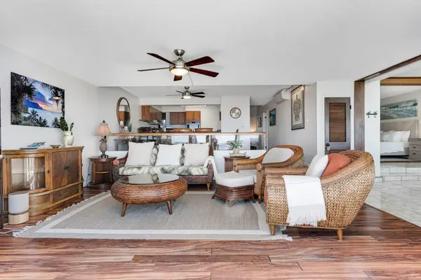 Spacious, cozy living room with warm wood details that make you want to stay