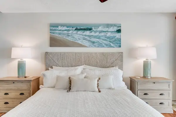 Primary bedroom with a plush headboard, perfect for resting comfortably